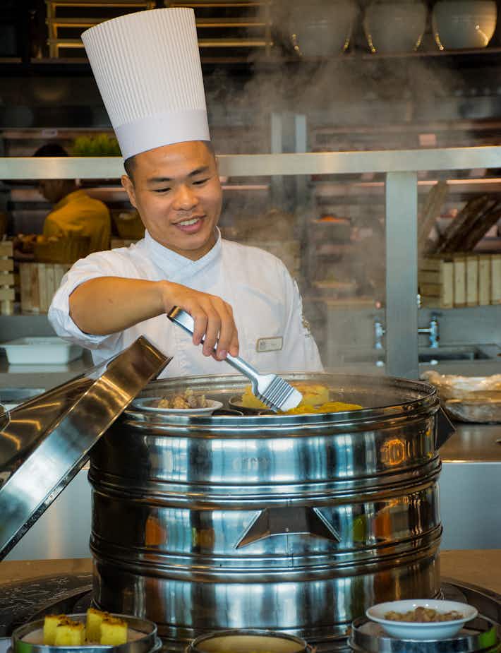 Chef preparing a Asian meal at The Kingsbury Hotel