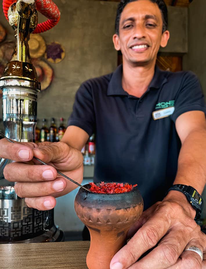 Bartender preparing a local culture-inspired cocktail at The Kingsbury Hotel 
